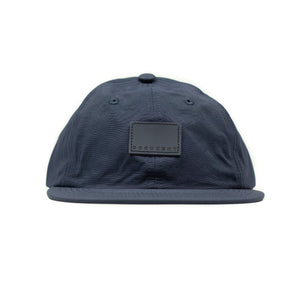 Baseball cap in navy nylon with tonal patch