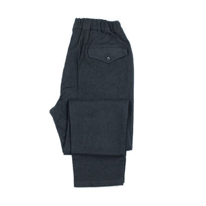 Pleated pegtop pants in navy tumbled wool twill